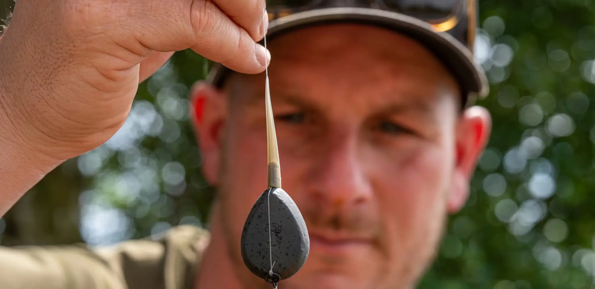 Dark gray teardrop drop-off fishing float with wooden stem