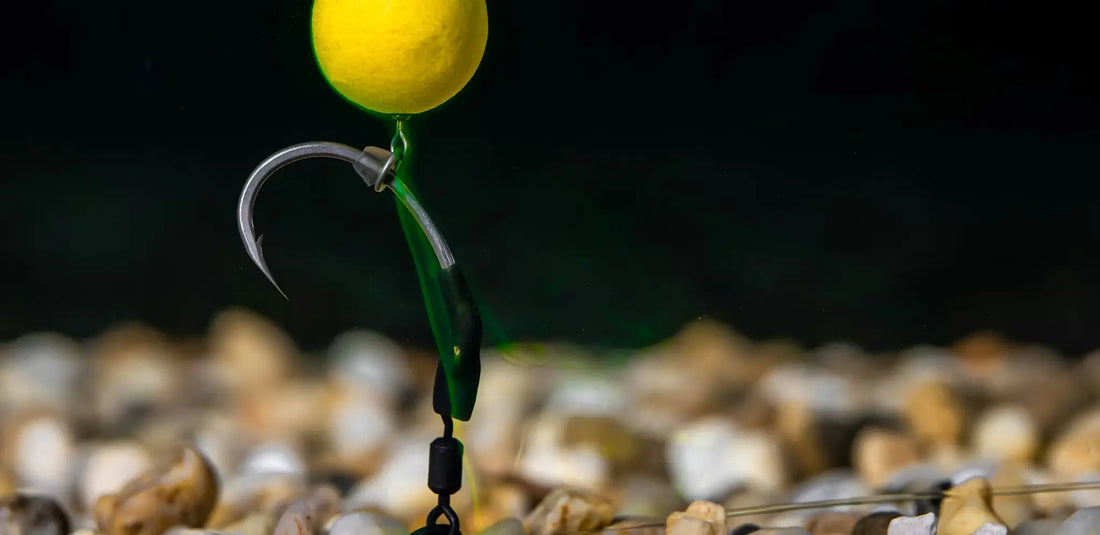 Yellow spherical bobber on hook and green leader for spinner rig