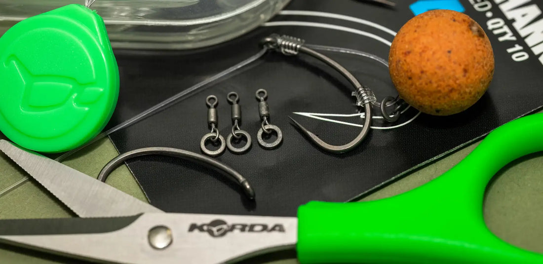 Bright green-handled Korda scissors open on black surface for IQ D Rig