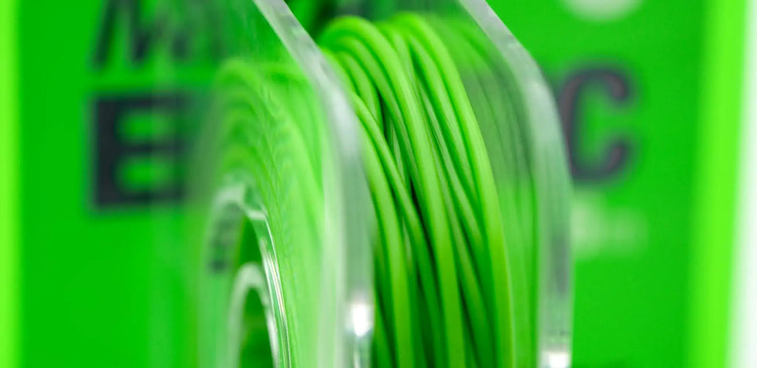 Bright green filament wound on clear plastic spool for Marker Elastic