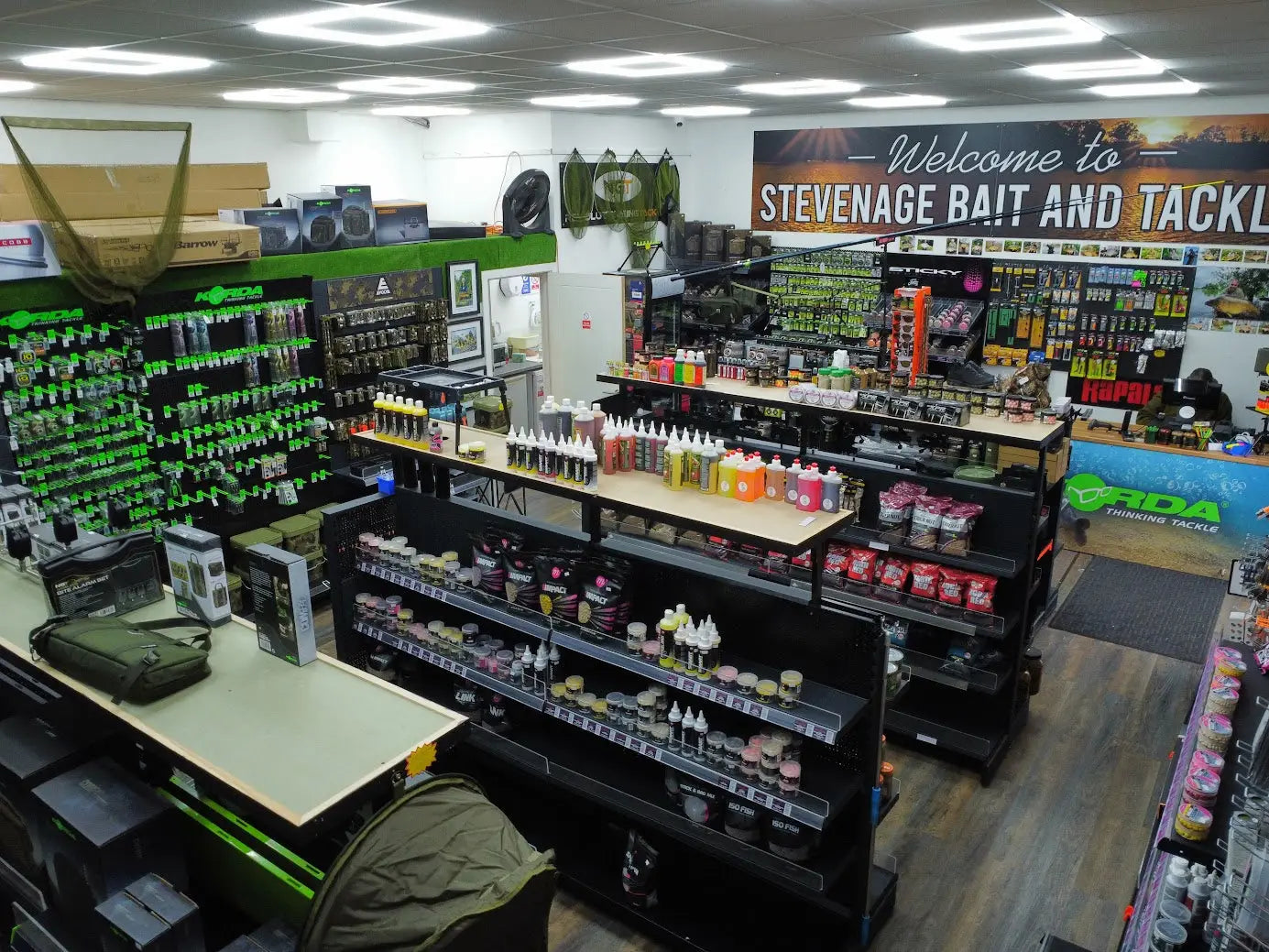 Stevenage Bait and Tackle store shelves stocked with colorful bait attractants