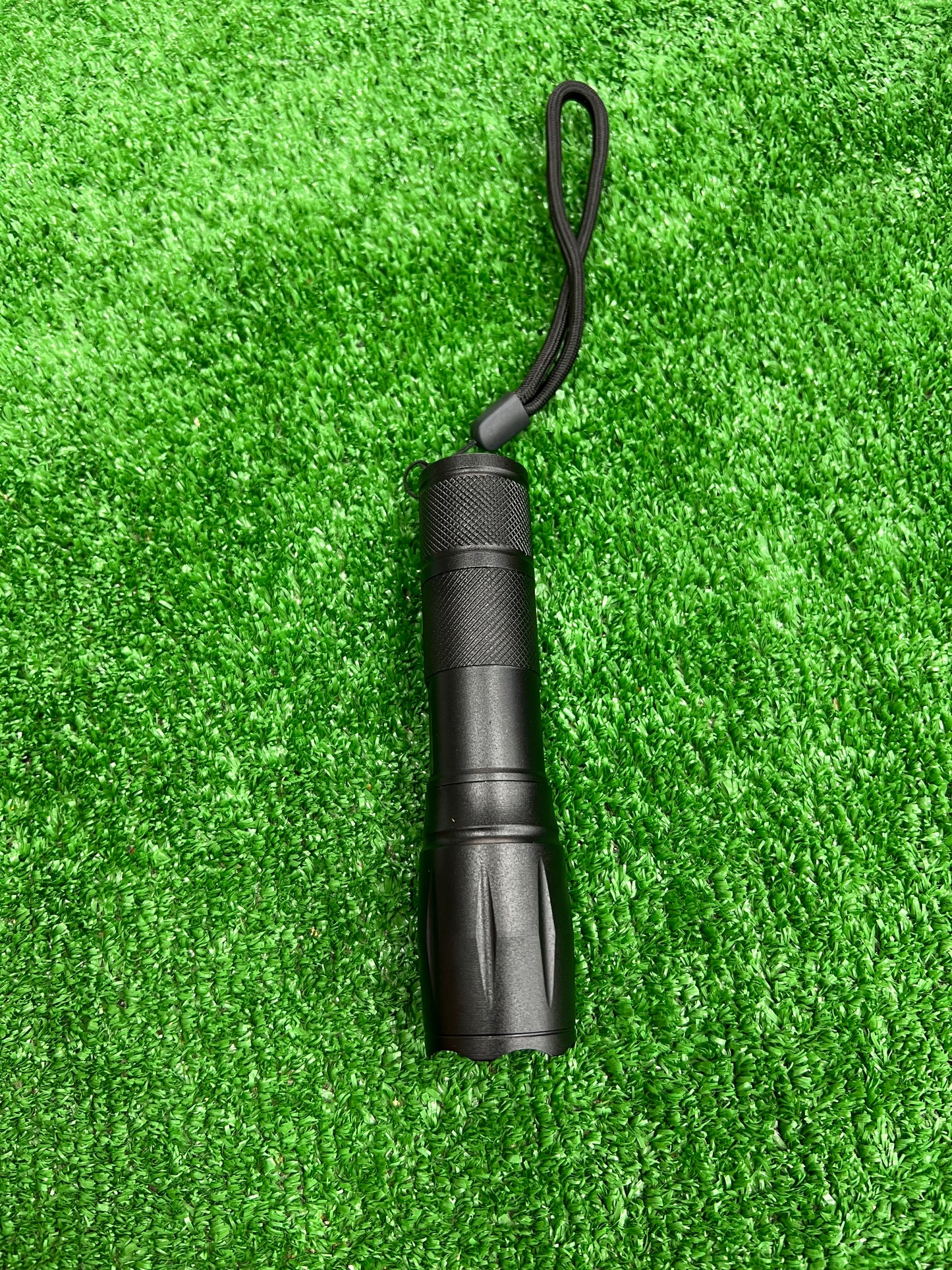 Red LED torch with zoom function.