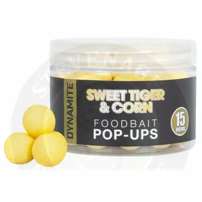 Yellow spherical food bait pop-ups in a clear jar with black and gold labeling dynamite’s sweet tiger corn wafters deliver explosive flavour in a compact 15mm package