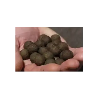 A handful of dark brown round textured pellets from elevate baits garlic infusion boilies 18mm 1kg