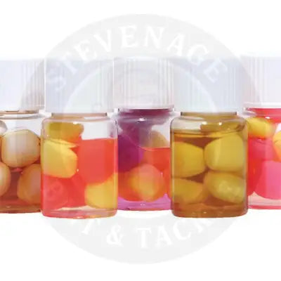 Clear glass bottles with white caps filled with colorful gummy candies for solar ester pineapple flavour popup sweetcorn