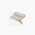Beige flextail cozy towel made of soft fabric with a gray tag perfect for comfortable drying and use