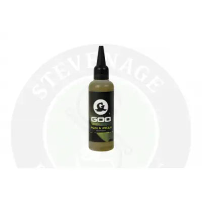 A sleek black korda goo bottle with a pointed nozzle filled with olive green liquid labeled goo pom and pear