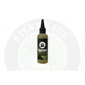 A sleek black korda goo bottle with a pointed nozzle filled with olive green liquid labeled goo pom and pear