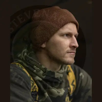 Rust brown knitted korda klassic beanie with ribbed texture in classic beanie shape for head warm use