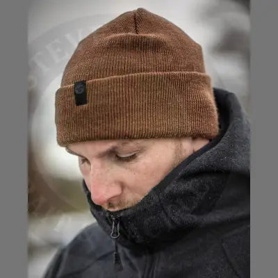 Korda klassic beanie rust brown ribbed knit with folded cuff and black patch in a classic beanie shape for head warm
