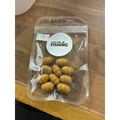 A clear plastic package of ten tan-colored fake tigernuts 10pcs fishing bait beads with live for fishing logo