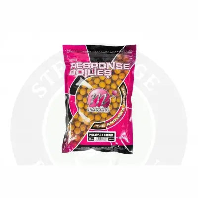 A vibrant pink and black mainline carp response pineapple and banana 15mm standard pack with golden-yellow boilies