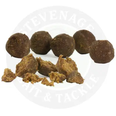 Brown round dog treats with rough texture and broken pieces from sticky baits the krill active freezer with amino acids