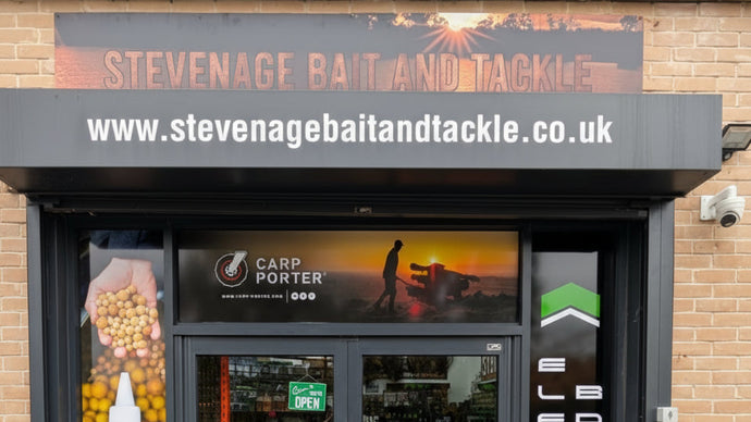 Storefront of Stevenage Bait and Tackle with various brand logos displayed.