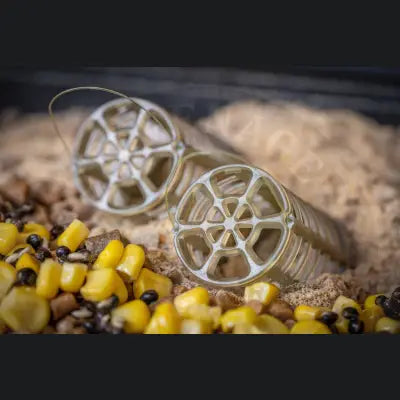 Silver-colored stevenage bait guru bait wheel-shaped containers with mesh design and thin wire handles for loose particles
