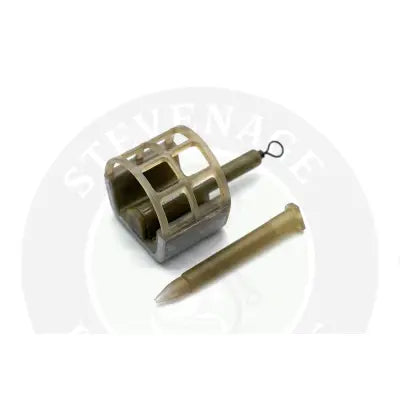 Olive-green plastic commercial cage feeder with grid design and hook for specimen anglers and stevenage bait use