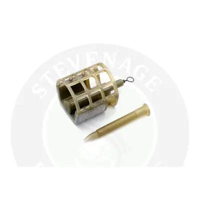 Tan plastic commercial cage feeder with grid design and needle-like insert ideal for specimen anglers and stevenage bait