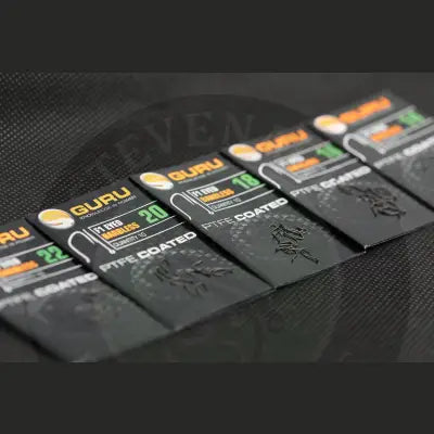 Black guru tackle guru f1 eyed ptfe-coated fishing hooks in various sizes on sleek branded black and orange cards