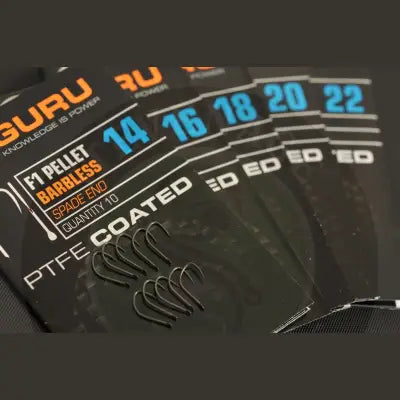 Black ptfe-coated guru f1 pellet barbless spade end hooks for targeting f1 carp with stevenage bait package