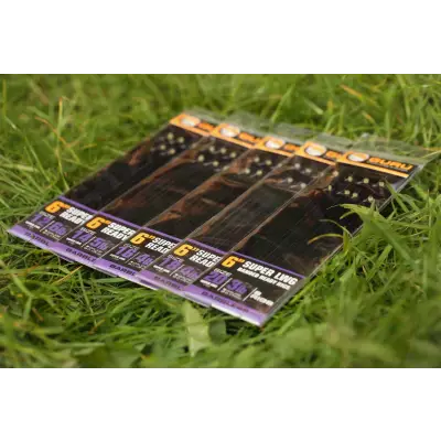Pack of guru 6-inch super head fishing lures in clear packaging with black and purple lwg bait band rig label from stevenage bait