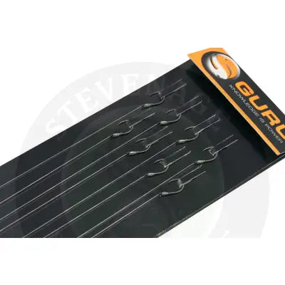 Black guru lwgs pole rigs strong fishing hooks arranged neatly on black card with orange stevenage bait branding