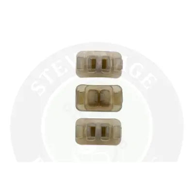 Three translucent beige plastic rectangular fishing lure stoppers with two slots from tackle guru method clip kit