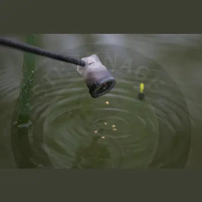 Black fishing rod tip with translucent plastic float and darkened base from Tackle Guru Pole Pot for Stevenage bait use