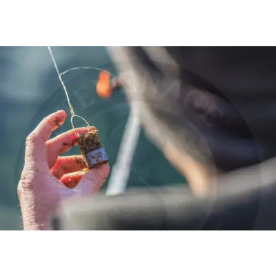 Tackle guru slimline x-change distance feeder in earthy brown with silver label and fine mesh wire top for stevenage bait use