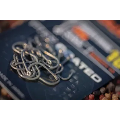 A pile of shiny silver metallic smwg barbed fishing hooks by tackle guru featuring proven mwgb hook design