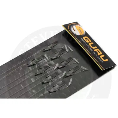 Black and transparent fishing leader clips on black guru branded packaging for feeder hair rigs by tackle guru