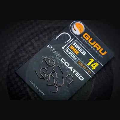 Tackle Guru super xs spade fishing hooks ptfe coated barbless in sleek black package with bold orange branding for stevenage bait