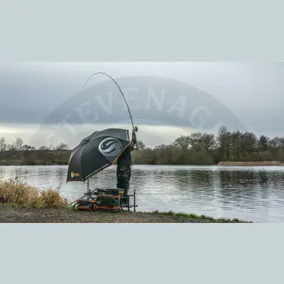 Black and orange tackle guru umbrella large deluxe waterproof 210d designed for outdoor fishing use with prominent logo