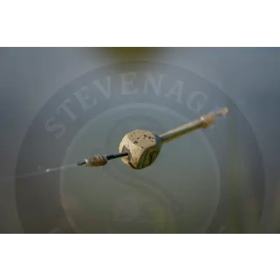 A metallic segmented fishing lure with a clear droplet, featuring guru tail rubbers for stevenage bait x-safe spare tail